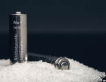 two rechargeable sodium ion batteries on a bunch of salt